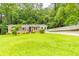 Brick ranch house with a spacious yard and driveway at 6626 Dorian Dr, Union City, GA 30291