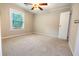 Large bedroom with ceiling fan and window coverings at 6626 Dorian Dr, Union City, GA 30291