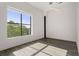 Sunlit living room featuring hardwood floors and a large window at 108 Park Place Unit 304, Decatur, GA 30030