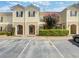 Two story tan building with black shutters and landscaping at 608 Summer Pl, Norcross, GA 30071