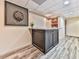 Basement bar area with dartboard, counter, and additional storage or hallway access at 1012 Jubilee Way, Powder Springs, GA 30127