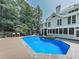 Inviting pool with a wood deck, lush trees, and plenty of space for lounging at 1012 Jubilee Way, Powder Springs, GA 30127