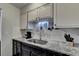 Granite countertop kitchen with sink and coffee maker at 3071 Colonial Way # J, Atlanta, GA 30341