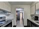 View of kitchen, dining area and hallway at 3071 Colonial Way # J, Atlanta, GA 30341