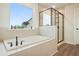 Bathroom with soaking tub, walk-in shower, and large window at 37 Ridgeline Nw Way, Cartersville, GA 30121