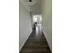 Long hallway with dark gray vinyl plank flooring at 37 Ridgeline Nw Way, Cartersville, GA 30121