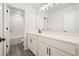 Double vanity bathroom with white cabinets and a large mirror at 37 Ridgeline Nw Way, Cartersville, GA 30121