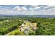 Aerial view of a residential neighborhood nestled among lush greenery and hills at 37 Ridgeline Nw Way, Cartersville, GA 30121