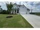 Two story home with white siding, three car garage, and front porch at 37 Ridgeline Nw Way, Cartersville, GA 30121