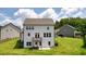 Rear view of a charming two-story house with a deck, showcasing its white siding and landscaping at 37 Ridgeline Nw Way, Cartersville, GA 30121