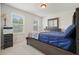 Spacious bedroom with a queen-size bed, two windows, and a dresser at 37 Ridgeline Nw Way, Cartersville, GA 30121