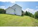 White two-story house on a grassy hill with a view at 37 Ridgeline Nw Way, Cartersville, GA 30121