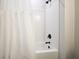 Bathroom with shower tub combo, white subway tiles, and black fixtures at 37 Ridgeline Nw Way, Cartersville, GA 30121