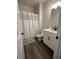 Clean bathroom with shower/tub combo, white vanity, and grey flooring at 37 Ridgeline Nw Way, Cartersville, GA 30121