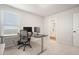 Bright home office features a built-in desk, two monitors, and an ensuite bathroom at 37 Ridgeline Nw Way, Cartersville, GA 30121