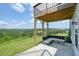 Covered patio with sectional sofa, enjoying hilltop views at 37 Ridgeline Nw Way, Cartersville, GA 30121