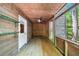 Relaxing screened porch with wood flooring and ceiling fan at 143 Beech St, Roswell, GA 30075