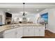 Kitchen features granite countertops, white cabinets, and a view into the living room at 545 Penny Ln, Loganville, GA 30052