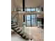 Modern floating staircase with glass and wood accents at 2147 Briarwillow Ne Dr, Atlanta, GA 30345