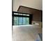 Spacious living area featuring a modern wood wall and hardwood floors at 2147 Briarwillow Ne Dr, Atlanta, GA 30345