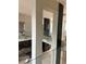 Modern glass railing staircase with views to the lower level at 2147 Briarwillow Ne Dr, Atlanta, GA 30345