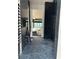 Walk-in wine cellar with dark marble tile and built-in racks at 2147 Briarwillow Ne Dr, Atlanta, GA 30345