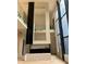 Modern two-story fireplace with marble and concrete details at 2147 Briarwillow Ne Dr, Atlanta, GA 30345