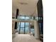 Two-story great room with floor to ceiling windows and marble fireplace at 2147 Briarwillow Ne Dr, Atlanta, GA 30345