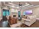 Spacious living area featuring a stone fireplace and large TV at 4317 Oglethorpe Nw Loop, Acworth, GA 30101