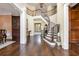 Impressive two-story foyer with a grand curved staircase and hardwood floors at 4317 Oglethorpe Nw Loop, Acworth, GA 30101
