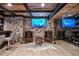 Elegant basement bar with stone accents, wine storage, and comfortable seating at 4317 Oglethorpe Nw Loop, Acworth, GA 30101