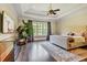 Spacious main bedroom with hardwood floors, large windows and a comfortable bed at 4317 Oglethorpe Nw Loop, Acworth, GA 30101