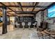 Finished basement with a home bar, stone feature wall, and seating area at 4317 Oglethorpe Nw Loop, Acworth, GA 30101