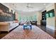 Playroom featuring a chalkboard wall, comfortable seating and ample natural light at 4317 Oglethorpe Nw Loop, Acworth, GA 30101