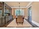 Elegant dining room featuring a large table, built-in cabinetry, and hardwood floors at 4317 Oglethorpe Nw Loop, Acworth, GA 30101