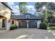 Two-car garage with dark doors and decorative accents at 4317 Oglethorpe Nw Loop, Acworth, GA 30101