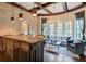 Basement bar with wooden cabinetry and seating area at 4317 Oglethorpe Nw Loop, Acworth, GA 30101