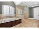 Primary bathroom with soaking tub and large walk-in shower at 4317 Oglethorpe Nw Loop, Acworth, GA 30101