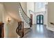 Grand foyer featuring a curved staircase and hardwood floors at 4317 Oglethorpe Nw Loop, Acworth, GA 30101