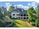 Home's back features a large covered patio and spacious backyard at 4317 Oglethorpe Nw Loop, Acworth, GA 30101