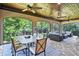 Relaxing screened porch with stone flooring and outdoor furniture at 4317 Oglethorpe Nw Loop, Acworth, GA 30101