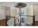 Grand staircase with ornate railing and chandelier at 4317 Oglethorpe Nw Loop, Acworth, GA 30101