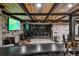 Finished basement bar with wine storage, TV and leather seating at 4317 Oglethorpe Nw Loop, Acworth, GA 30101