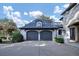 Detached two-car garage with dark gray doors and gray roof at 4317 Oglethorpe Nw Loop, Acworth, GA 30101