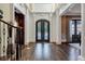 Elegant two-story entryway with dark hardwood floors and ornate doors at 4317 Oglethorpe Nw Loop, Acworth, GA 30101