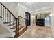 Bright entryway with a grand staircase and piano at 4317 Oglethorpe Nw Loop, Acworth, GA 30101