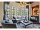 Bright sitting room with large windows and comfortable seating at 4317 Oglethorpe Nw Loop, Acworth, GA 30101