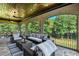 Spacious screened porch with comfortable seating and beautiful wooded views at 4317 Oglethorpe Nw Loop, Acworth, GA 30101