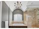 Spa-like bathroom with soaking tub, walk-in shower, and chandelier at 4317 Oglethorpe Nw Loop, Acworth, GA 30101