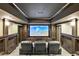 Basement home theater with tiered seating and large screen at 4317 Oglethorpe Nw Loop, Acworth, GA 30101